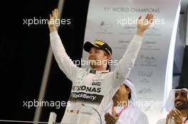 Race winner Nico Rosberg (GER) Mercedes AMG F1 celebrates on the podium. 29.11.2015. Formula 1 World Championship, Rd 19, Abu Dhabi Grand Prix, Yas Marina Circuit, Abu Dhabi, Race Day.