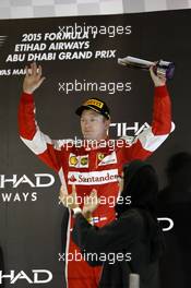 Kimi Raikkonen (FIN) Ferrari celebrates his third position on the podium. 29.11.2015. Formula 1 World Championship, Rd 19, Abu Dhabi Grand Prix, Yas Marina Circuit, Abu Dhabi, Race Day.