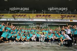 Race winner Nico Rosberg (GER) Mercedes AMG F1 celebrates with team mate Lewis Hamilton (GBR) Mercedes AMG F1 and the team. 29.11.2015. Formula 1 World Championship, Rd 19, Abu Dhabi Grand Prix, Yas Marina Circuit, Abu Dhabi, Race Day.