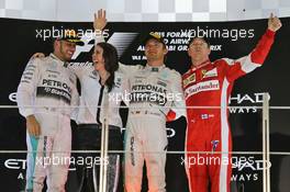 The podium (L to R): Lewis Hamilton (GBR) Mercedes AMG F1, second; Nico Rosberg (GER) Mercedes AMG F1, race winner; Kimi Raikkonen (FIN) Ferrari, third. 29.11.2015. Formula 1 World Championship, Rd 19, Abu Dhabi Grand Prix, Yas Marina Circuit, Abu Dhabi, Race Day.