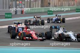 Sebastian Vettel (GER), Scuderia Ferrari and Valtteri Bottas (FIN), Williams F1 Team  29.11.2015. Formula 1 World Championship, Rd 19, Abu Dhabi Grand Prix, Yas Marina Circuit, Abu Dhabi, Race Day.