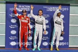 Qualifying top three in parc ferme (L to R): Kimi Raikkonen (FIN) Ferrari, third; Nico Rosberg (GER) Mercedes AMG F1, pole position; Lewis Hamilton (GBR) Mercedes AMG F1, second. 28.11.2015. Formula 1 World Championship, Rd 19, Abu Dhabi Grand Prix, Yas Marina Circuit, Abu Dhabi, Qualifying Day.