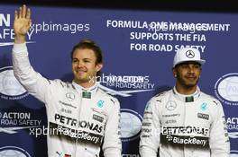 (L to R): Nico Rosberg (GER) Mercedes AMG F1 celebrates his pole position alongside second placed team mate Lewis Hamilton (GBR) Mercedes AMG F1. 28.11.2015. Formula 1 World Championship, Rd 19, Abu Dhabi Grand Prix, Yas Marina Circuit, Abu Dhabi, Qualifying Day.