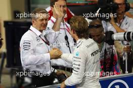 Nico Rosberg (GER) Mercedes AMG F1 celebrates his pole position with Thomas Weber (GER) Member of the Board of Management of Daimler AG in parc ferme. 28.11.2015. Formula 1 World Championship, Rd 19, Abu Dhabi Grand Prix, Yas Marina Circuit, Abu Dhabi, Qualifying Day.