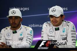 (L to R): Lewis Hamilton (GBR) Mercedes AMG F1 and team mate Nico Rosberg (GER) Mercedes AMG F1 in the post qualifying FIA Press Conference. 28.11.2015. Formula 1 World Championship, Rd 19, Abu Dhabi Grand Prix, Yas Marina Circuit, Abu Dhabi, Qualifying Day.