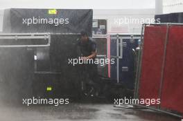 A Mercedes AMG F1 mechanic struggles in the paddock during a thunderstorm that cancelled FP2. 23.10.2015. Formula 1 World Championship, Rd 16, United States Grand Prix, Austin, Texas, USA, Practice Day.