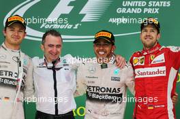 The podium (L to R): Nico Rosberg (GER) Mercedes AMG F1, second; Paddy Lowe (GBR) Mercedes AMG F1 Executive Director (Technical); Lewis Hamilton (GBR) Mercedes AMG F1, race winner and World Champion; Sebastian Vettel (GER) Ferrari, third. 25.10.2015. Formula 1 World Championship, Rd 16, United States Grand Prix, Austin, Texas, USA, Race Day.