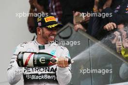 Race winner and World Champion Lewis Hamilton (GBR) Mercedes AMG F1 celebrates on the podium. 25.10.2015. Formula 1 World Championship, Rd 16, United States Grand Prix, Austin, Texas, USA, Race Day.