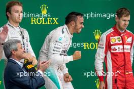 The podium (L to R): Nico Rosberg (GER) Mercedes AMG F1, second; Lewis Hamilton (GBR) Mercedes AMG F1, race winner and World Champion; Sebastian Vettel (GER) Ferrari, third. 25.10.2015. Formula 1 World Championship, Rd 16, United States Grand Prix, Austin, Texas, USA, Race Day.