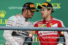 Race winner and World Champion Lewis Hamilton (GBR) Mercedes AMG F1 celebrates on the podium with Sebastian Vettel (GER) Ferrari. 25.10.2015. Formula 1 World Championship, Rd 16, United States Grand Prix, Austin, Texas, USA, Race Day.