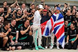 Race winner and World Champion Lewis Hamilton (GBR) Mercedes AMG F1 celebrates with team mate Nico Rosberg (GER) Mercedes AMG F1 and the team. 25.10.2015. Formula 1 World Championship, Rd 16, United States Grand Prix, Austin, Texas, USA, Race Day.