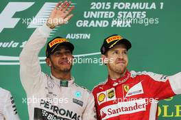 Race winner and World Champion Lewis Hamilton (GBR) Mercedes AMG F1 celebrates on the podium with Sebastian Vettel (GER) Ferrari. 25.10.2015. Formula 1 World Championship, Rd 16, United States Grand Prix, Austin, Texas, USA, Race Day.