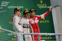 Nico Rosberg (GER), Mercedes AMG F1 Team, Sebastian Vettel (GER), Scuderia Ferrari and Kimi Raikkonen (FIN), Scuderia Ferrari  25.10.2015. Formula 1 World Championship, Rd 16, United States Grand Prix, Austin, Texas, USA, Race Day.