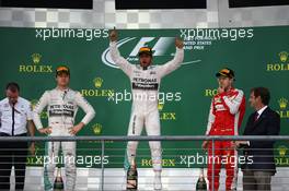 1st place and world champion Lewis Hamilton (GBR) Mercedes AMG F1, with 2nd place Nico Rosberg (GER) Mercedes AMG F1 W06 and 3rd place Sebastian Vettel (GER) Ferrari. 25.10.2015. Formula 1 World Championship, Rd 16, United States Grand Prix, Austin, Texas, USA, Race Day.