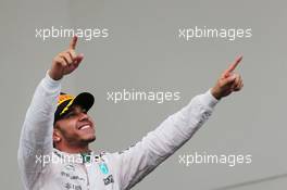 Race winner and World Champion Lewis Hamilton (GBR) Mercedes AMG F1 celebrates on the podium. 25.10.2015. Formula 1 World Championship, Rd 16, United States Grand Prix, Austin, Texas, USA, Race Day.