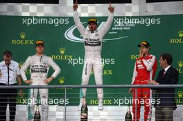 1st place and world champion Lewis Hamilton (GBR) Mercedes AMG F1, with 2nd place Nico Rosberg (GER) Mercedes AMG F1 W06 and 3rd place Sebastian Vettel (GER) Ferrari. 25.10.2015. Formula 1 World Championship, Rd 16, United States Grand Prix, Austin, Texas, USA, Race Day.