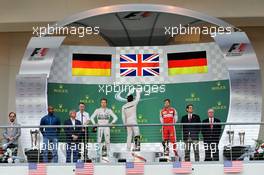 The podium (L to R): Nico Rosberg (GER) Mercedes AMG F1, second; Lewis Hamilton (GBR) Mercedes AMG F1, race winner and World Champion; Sebastian Vettel (GER) Ferrari, third. 25.10.2015. Formula 1 World Championship, Rd 16, United States Grand Prix, Austin, Texas, USA, Race Day.