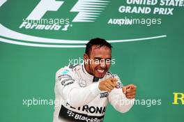 Race winner and World Champion Lewis Hamilton (GBR) Mercedes AMG F1 celebrates on the podium. 25.10.2015. Formula 1 World Championship, Rd 16, United States Grand Prix, Austin, Texas, USA, Race Day.