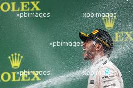 Race winner and World Champion Lewis Hamilton (GBR) Mercedes AMG F1 celebrates on the podium. 25.10.2015. Formula 1 World Championship, Rd 16, United States Grand Prix, Austin, Texas, USA, Race Day.