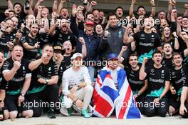 Race winner and World Champion Lewis Hamilton (GBR) Mercedes AMG F1 celebrates with team mate Nico Rosberg (GER) Mercedes AMG F1 and the team. 25.10.2015. Formula 1 World Championship, Rd 16, United States Grand Prix, Austin, Texas, USA, Race Day.