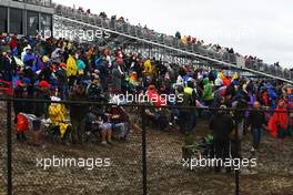 Fans in the mud. 25.10.2015. Formula 1 World Championship, Rd 16, United States Grand Prix, Austin, Texas, USA, Race Day.