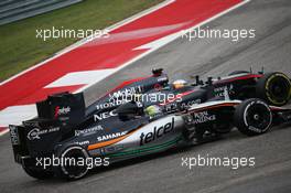 Fernando Alonso (ESP) McLaren MP4-30 and Sergio Perez (MEX) Sahara Force India F1 VJM08 battle for position. 25.10.2015. Formula 1 World Championship, Rd 16, United States Grand Prix, Austin, Texas, USA, Race Day.