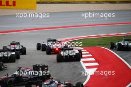 Lewis Hamilton (GBR) Mercedes AMG F1 W06 leads at the start of the race as Nico Rosberg (GER) Mercedes AMG F1 W06 runs wide and Fernando Alonso (ESP) McLaren MP4-30 spins. 25.10.2015. Formula 1 World Championship, Rd 16, United States Grand Prix, Austin, Texas, USA, Race Day.