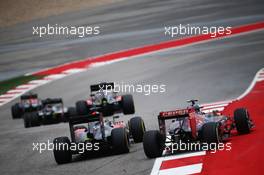 Carlos Sainz Jr (ESP) Scuderia Toro Rosso STR10 and Fernando Alonso (ESP) McLaren MP4-30 battle for position. 25.10.2015. Formula 1 World Championship, Rd 16, United States Grand Prix, Austin, Texas, USA, Race Day.