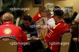 Team Members of Penske Racing reading Newspaper 23.02.2015, NASCAR Daytona 500 Champions Breakfast, Daytona International Speedway