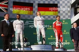 The podium (L to R): Lewis Hamilton (GBR) Mercedes AMG F1, second; Nico Rosberg (GER) Mercedes AMG F1, race winner; Sebastian Vettel (GER) Ferrari, third. 20.03.2016. Formula 1 World Championship, Rd 1, Australian Grand Prix, Albert Park, Melbourne, Australia, Race Day.