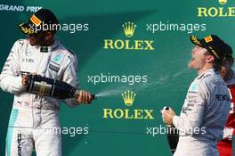 2nd place Lewis Hamilton (GBR) Mercedes Petronas AMG F1 with 1st place Nico Rosberg (GER) Mercedes AMG Petronas F1 W07. 20.03.2016. Formula 1 World Championship, Rd 1, Australian Grand Prix, Albert Park, Melbourne, Australia, Race Day.