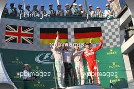 The podium (L to R): Lewis Hamilton (GBR) Mercedes AMG F1, second; Nico Rosberg (GER) Mercedes AMG F1, race winner; Sebastian Vettel (GER) Ferrari, third. 20.03.2016. Formula 1 World Championship, Rd 1, Australian Grand Prix, Albert Park, Melbourne, Australia, Race Day.