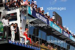 The podium (L to R): Lewis Hamilton (GBR) Mercedes AMG F1, second; Nico Rosberg (GER) Mercedes AMG F1, race winner; Mark Webber (AUS) Porsche Team WEC Driver / Channel 4 Presenter; Sebastian Vettel (GER) Ferrari, third. 20.03.2016. Formula 1 World Championship, Rd 1, Australian Grand Prix, Albert Park, Melbourne, Australia, Race Day.