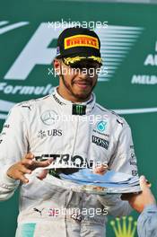 Lewis Hamilton (GBR) Mercedes AMG F1 celebrates his second position on the podium. 20.03.2016. Formula 1 World Championship, Rd 1, Australian Grand Prix, Albert Park, Melbourne, Australia, Race Day.