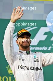 Lewis Hamilton (GBR) Mercedes AMG F1 celebrates his second position on the podium. 20.03.2016. Formula 1 World Championship, Rd 1, Australian Grand Prix, Albert Park, Melbourne, Australia, Race Day.