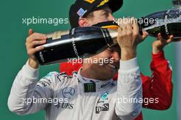 Race winner Nico Rosberg (GER) Mercedes AMG F1 celebrates with the champagne on the podium. 20.03.2016. Formula 1 World Championship, Rd 1, Australian Grand Prix, Albert Park, Melbourne, Australia, Race Day.