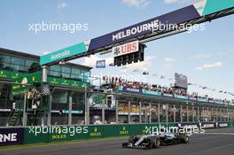 Race winner Nico Rosberg (GER) Mercedes AMG F1 W07 Hybrid takes the chequered flag at the end of the race. 20.03.2016. Formula 1 World Championship, Rd 1, Australian Grand Prix, Albert Park, Melbourne, Australia, Race Day.