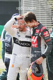 (L to R): Fernando Alonso (ESP) McLaren and Esteban Gutierrez (MEX) Haas F1 Team after their race stopping crash. 20.03.2016. Formula 1 World Championship, Rd 1, Australian Grand Prix, Albert Park, Melbourne, Australia, Race Day.