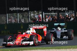 Sebastian Vettel (GER), Scuderia Ferrari and Lewis Hamilton (GBR), Mercedes AMG F1 Team  20.03.2016. Formula 1 World Championship, Rd 1, Australian Grand Prix, Albert Park, Melbourne, Australia, Race Day.