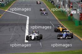(L to R): Valtteri Bottas (FIN) Williams FW38 and Marcus Ericsson (SWE) Sauber C35 battle for position. 20.03.2016. Formula 1 World Championship, Rd 1, Australian Grand Prix, Albert Park, Melbourne, Australia, Race Day.