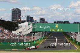 Esteban Gutierrez (MEX) Haas F1 Team VF-16 leads Fernando Alonso (ESP) McLaren MP4-31. 20.03.2016. Formula 1 World Championship, Rd 1, Australian Grand Prix, Albert Park, Melbourne, Australia, Race Day.