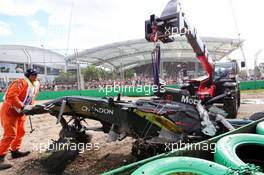 The McLaren MP4-31 of Fernando Alonso (ESP) McLaren is removed from the gravel trap after his race stopping crash. 20.03.2016. Formula 1 World Championship, Rd 1, Australian Grand Prix, Albert Park, Melbourne, Australia, Race Day.