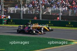 Jolyon Palmer (GBR) Renault Sport F1 Team RS16 and Carlos Sainz Jr (ESP) Scuderia Toro Rosso STR11 battle for position. 20.03.2016. Formula 1 World Championship, Rd 1, Australian Grand Prix, Albert Park, Melbourne, Australia, Race Day.