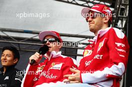 (L to R): Kimi Raikkonen (FIN) Ferrari with Sebastian Vettel (GER) Ferrari. 19.03.2016. Formula 1 World Championship, Rd 1, Australian Grand Prix, Albert Park, Melbourne, Australia, Qualifying Day.