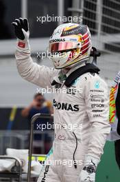 Lewis Hamilton (GBR) Mercedes AMG F1 celebrates his in parc ferme. 19.03.2016. Formula 1 World Championship, Rd 1, Australian Grand Prix, Albert Park, Melbourne, Australia, Qualifying Day.