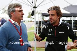 (L to R): Carlos Sainz (ESP) with Fernando Alonso (ESP) McLaren. 19.03.2016. Formula 1 World Championship, Rd 1, Australian Grand Prix, Albert Park, Melbourne, Australia, Qualifying Day.