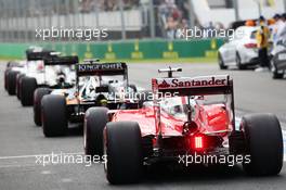 Sebastian Vettel (GER) Ferrari SF16-H joins the queue at the pit lane exit. 19.03.2016. Formula 1 World Championship, Rd 1, Australian Grand Prix, Albert Park, Melbourne, Australia, Qualifying Day.