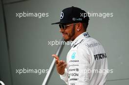 Lewis Hamilton (GBR) Mercedes AMG F1 celebrates his pole position in parc ferme. 19.03.2016. Formula 1 World Championship, Rd 1, Australian Grand Prix, Albert Park, Melbourne, Australia, Qualifying Day.