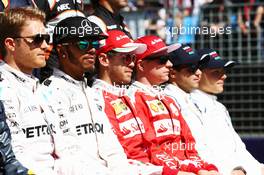 Lewis Hamilton (GBR) Mercedes AMG F1 and Sebastian Vettel (GER) Ferrari at the drivers start of season group photograph. 20.03.2016. Formula 1 World Championship, Rd 1, Australian Grand Prix, Albert Park, Melbourne, Australia, Race Day.