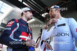 (L to R): Romain Grosjean (FRA) Haas F1 Team with Jenson Button (GBR) McLaren. 20.03.2016. Formula 1 World Championship, Rd 1, Australian Grand Prix, Albert Park, Melbourne, Australia, Race Day.